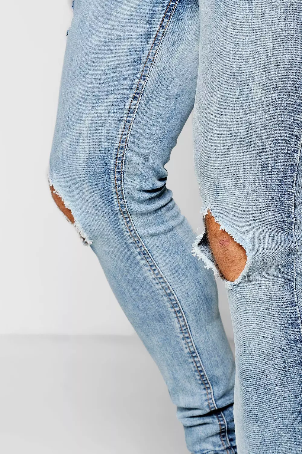 Light blue best sale ripped knee jeans